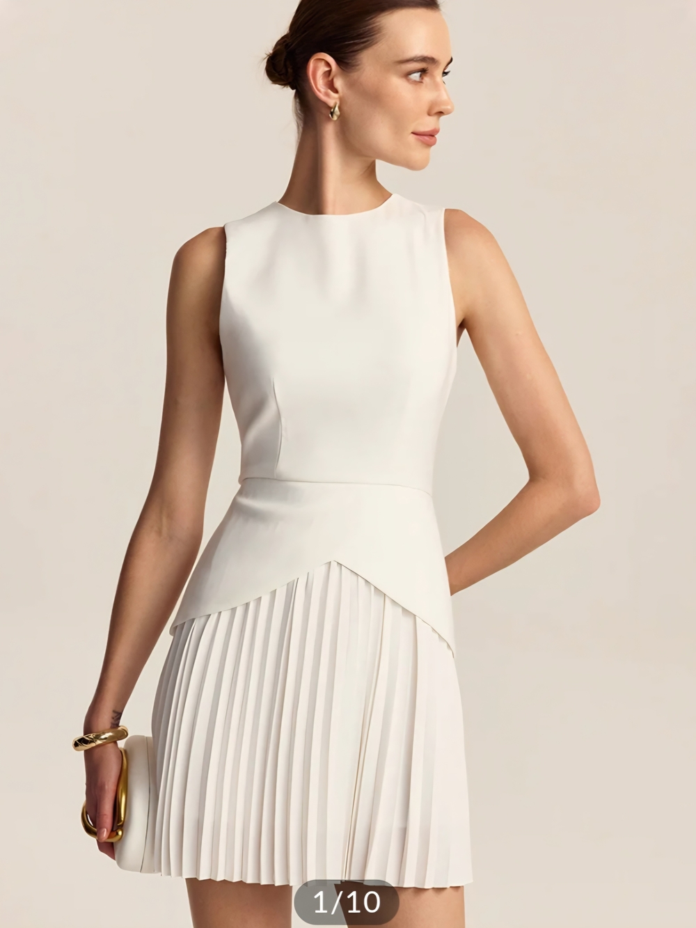Sleeveless Pleated Hem Mini Dress.